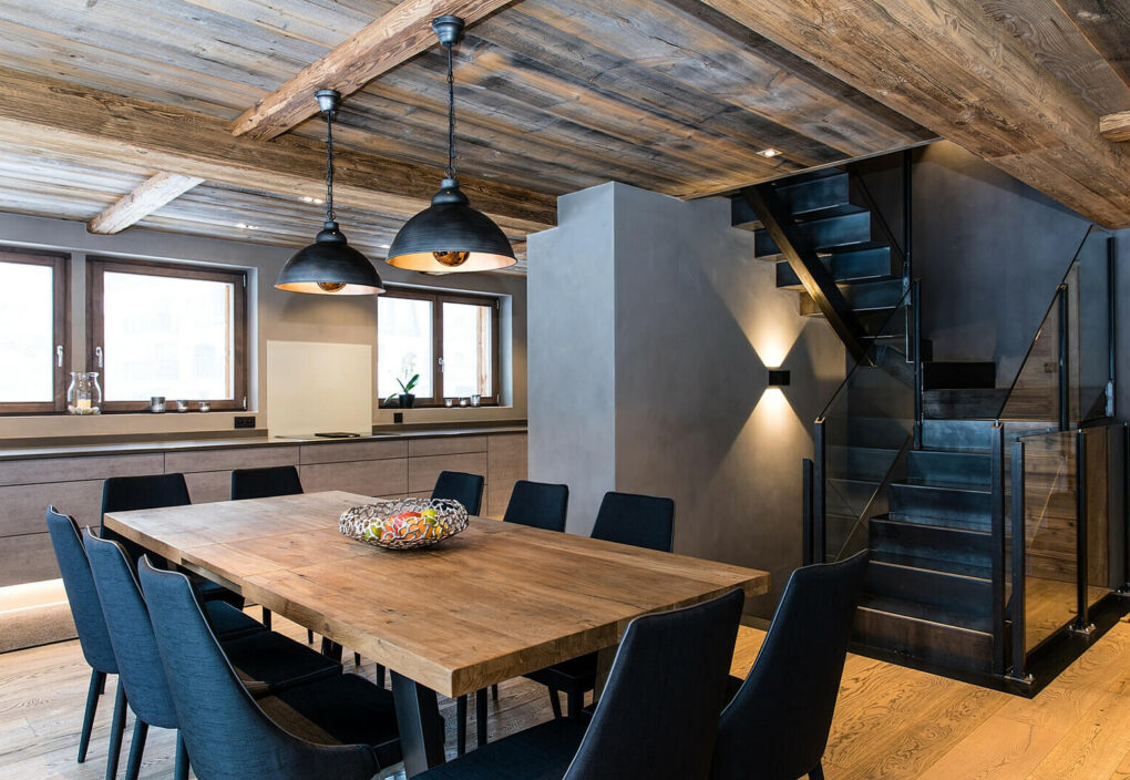 Dining table for 10 in front of glass doors onto deck