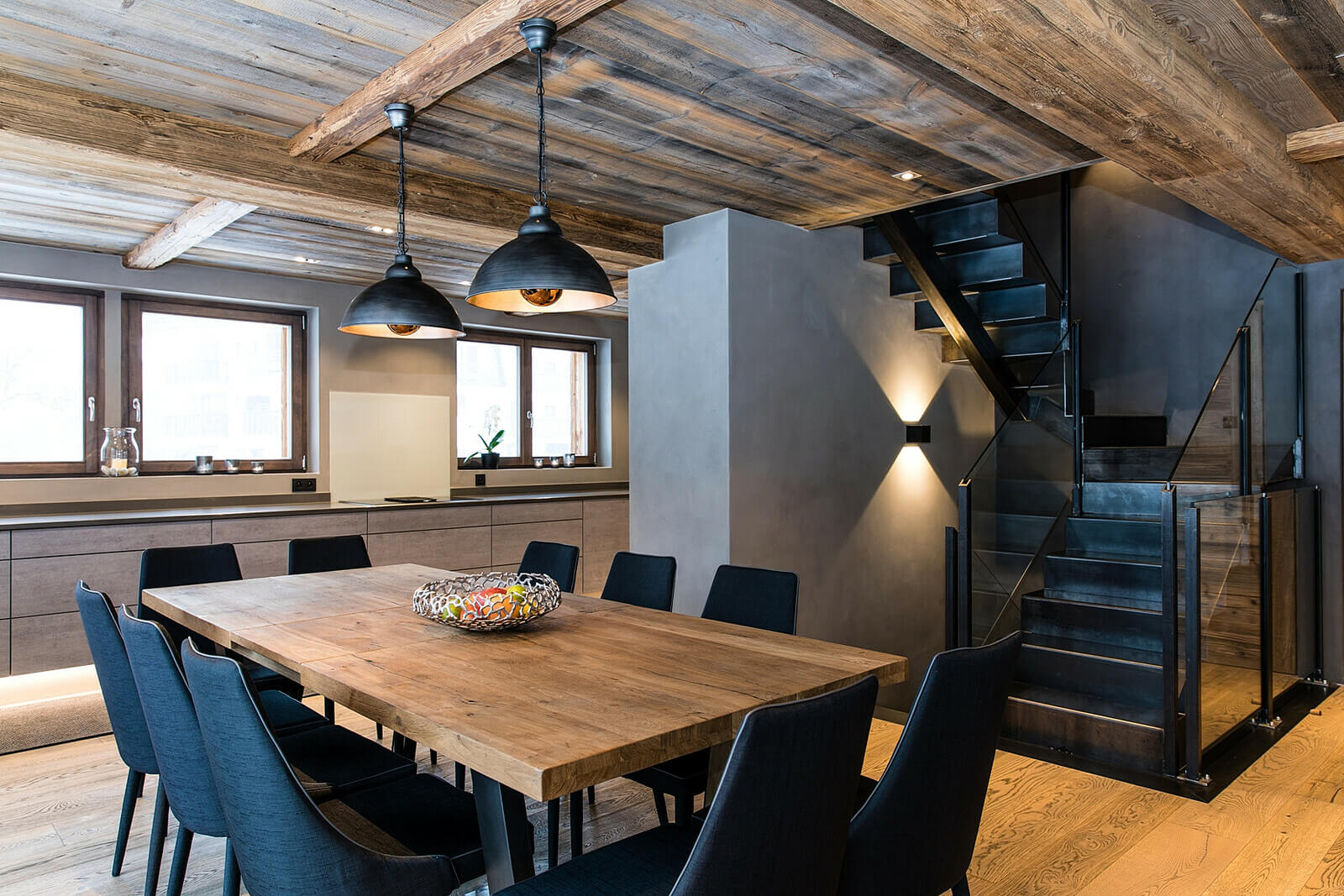 Dining table for 10 in front of glass doors onto deck